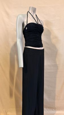 the mannequin is wearing a black top and black pants