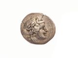 une image représentant une pièce d'argent sur laquelle figure une femme