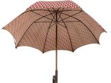 brown and pink umbrella with a black handle on a white background