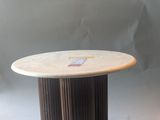 a round table with a wooden base and a marble top