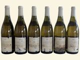 six bottles of wine are lined up in a row on a white background