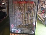a display case with guns in it in a store