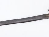 an image of a knife that is on a white surface