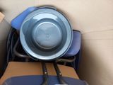 a bowl and a pan sitting in a cardboard box
