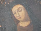 an old painting of a woman with a veil on her head