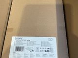 a cardboard box with a sticker on it sitting on a table