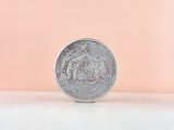 a close up of a coin sitting on top of a table