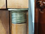 a close up of a door handle on a wooden door