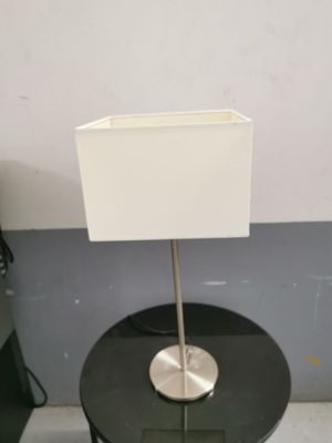 a small table with a lamp on top of it