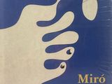 an image of a blue and white poster with a hand holding a drop of water