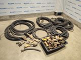 a lot of hoses and other tools on the floor