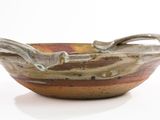 a small bowl that has a handle on it