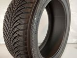 a close up of a tire on a white surface