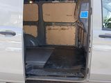 a white van with its door open and a box in the back