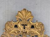 a mirror that is sitting on the wall in the room