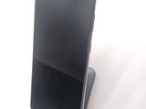 a cell phone that is sitting on top of a stand