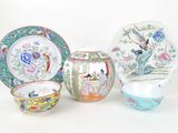four pieces of chinese porcelain on a white background