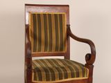 an image of a wooden chair with a striped upholstered seat