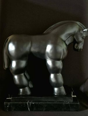 a statue of a horse that is standing on a pedestal