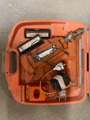a orange tool box with tools in it on the floor