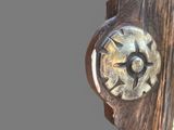 a close up of a wooden door handle with a star on it