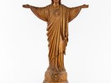 a statue of jesus on a pedestal on a white background