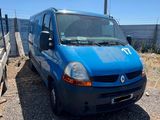 a blue van that is parked on the side of the road
