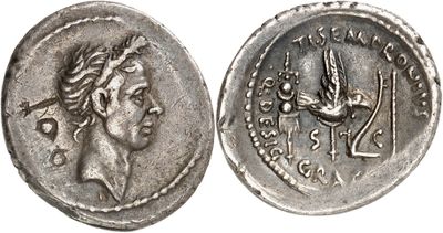 a silver coin with an image of a woman and a bird on it