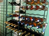 many bottles of wine on the rack in the room