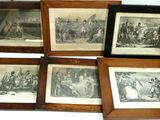 four framed pictures of a group of people in a room