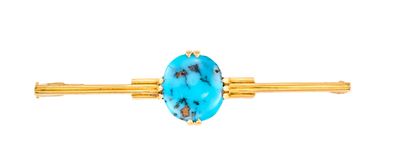 un gros plan d'une broche en pierre bleue sur fond blanc