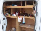 a white van that has some shelves inside of it