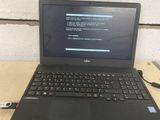 a laptop computer that is sitting on a table