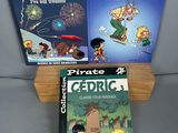 three children ' s books are sitting on a shelf next to each other