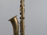a saxophone that is hanging from the ceiling