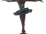 bronze statue of a young ballerina in a tutu on a pedestal