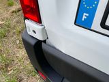 a close up of a car ' s license plate on the back of it