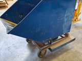 a blue cart that is sitting in a garage