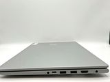 an open laptop computer sitting on top of a white table