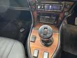 a car dashboard with a radio and a steering control