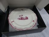 a plate in a box on a table with a white table cloth