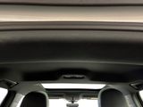 a view from inside of a car of the driver ' s seat