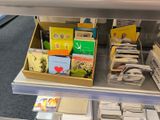 a display of books and magazines on a shelf