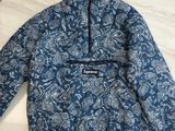 a close up of a blue and white jacket on a table