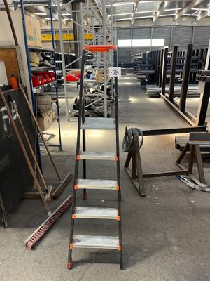 an image of a metal ladder in a warehouse