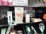 a shelf with a lot of beauty products on it