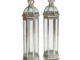 pair of silver and glass lanterns with crowns on top