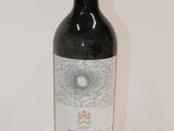 a bottle of wine that is sitting on a table