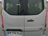 a white van that is parked on the side of the road
