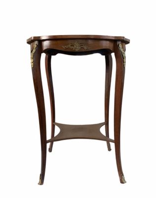 an image of a small table with a wooden top and gold decorations